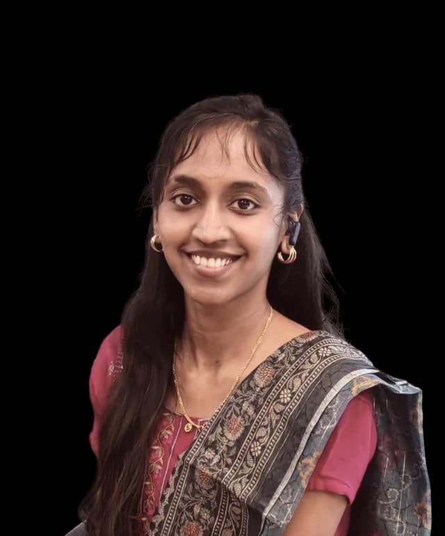Devi, photographed in a saree against the Abrix red panel
